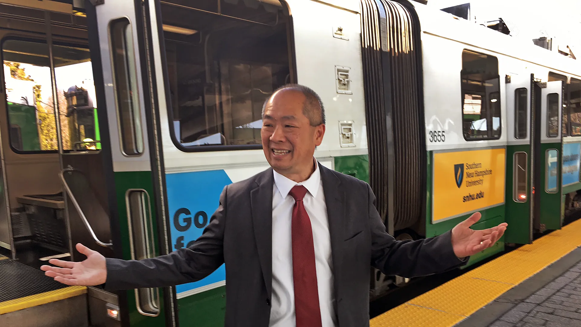 Phil Eng in front of a Green Line train